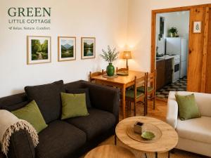 a living room with a couch and a table at Green Cottage in Podgorica