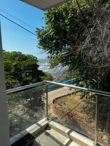 a balcony with a view of the ocean at La Rosita 2 in Puerto Colombia