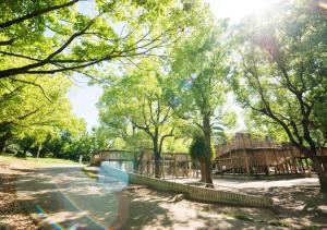 a playground in a park with trees at Super Hotel Midosujisen Esaka in Suita +66 photos