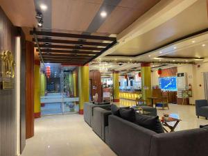 a lobby with couches and chairs in a store at A&A Plaza Hotel in Puerto Princesa City