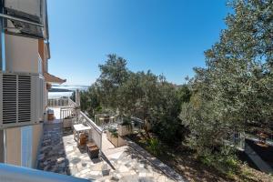 an overhead view of a balcony of a house with trees at Monte Mare in Donji Seget