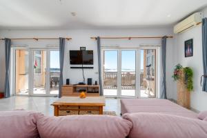 a living room with a couch and a table at Monte Mare in Donji Seget
