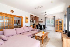 a living room with a couch and a table at Monte Mare in Donji Seget