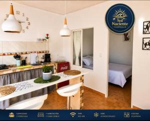 a small kitchen with a table and a room at Alojamiento Sol Naciente in Puerto Triunfo