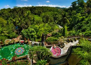 an overhead view of a pool at a resort at River Song Ubud, Bali in Ubud