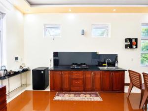 a kitchen with a sink and a counter top at The Mellow House Nhật Lệ in Dong Hoi