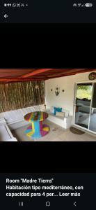 a picture of a room with a couch and a table at brisas costeña in Santa Marta