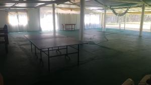 an empty room with a table in the middle of it at El Campito in Abasto