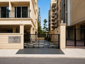 a building with a gate and stairs in a city at ASPA Apartments in Navi Mumbai