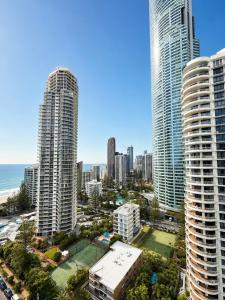a view of a city with tall buildings and the ocean at Stunning Oceanview - Beachfront hotel suite in Gold Coast