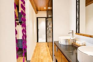 a bathroom with a sink and a mirror at Larosa Homestay Sapa in Sa Pả