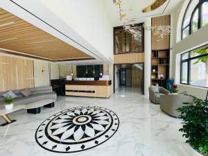 a lobby with couches and a table at Sala Lan Anh hotel in Phước Long