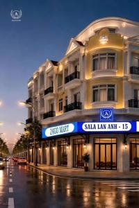 a building with a sign in front of a street at Sala Lan Anh hotel in Phước Long