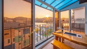 a balcony with a view of the mountains at Gapyeong Arom Spa Pension in Gapyeong