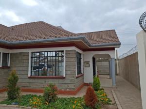 a small house with a brown roof at BlessRoyal Home in Kitengela 
