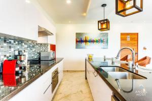 a kitchen with a sink and a counter top at Eight Condos Multi Listing in Playa del Carmen