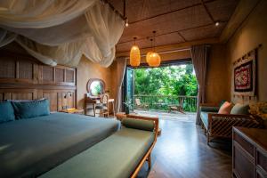 a bedroom with a bed and a large window at Pu Luong Eco Garden in Pu Luong +98 photos