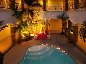 a courtyard with a swimming pool in a building at Bayfront Hotel Subic in Olongapo