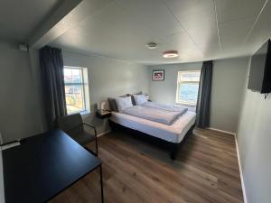 Llit o llits en una habitació de Hótel Gerpir