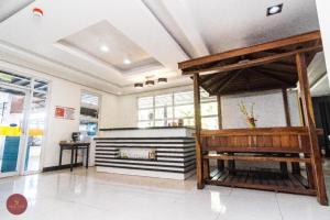 a large room with a piano and a bench at Sioland Grand Premier Hotel Candelaria in Candelaria