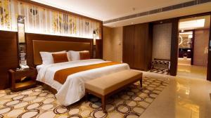 a bedroom with a large bed in a room at Jai Alai Hotel in Macau +158 photos