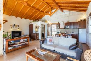 a living room with a couch and a table at Villa Nionios in Vlachopoulátika