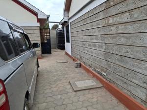 a car parked in front of a building at BlessRoyal Home in Kitengela 