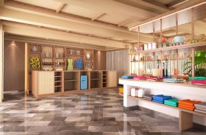 a room with a kitchen with a counter and shelves at Zel Cozumel in Cozumel