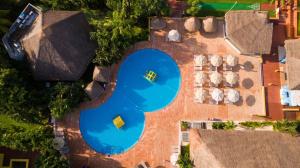 an overhead view of a house with a large blue pool at Zel Cozumel in Cozumel