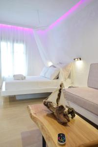 a room with a bed and a skull on a table at Afytos Lofts in Afitos