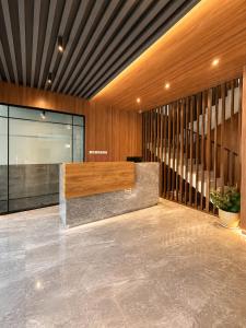a lobby with a reception desk in a building at Wisma Pelangi 1 in Jakarta