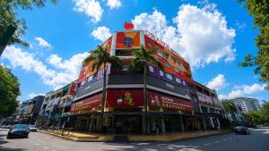 a tall building on the side of a street at Orange Hotel Kota Kemuning @ Shah Alam in Shah Alam