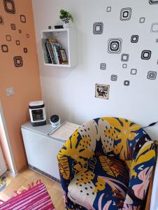 a living room with a chair and a desk at Agape in Niš