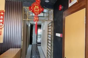 a hallway with a red chandelier in a building at Golden Night Hotel Sunway in Petaling Jaya +58 photos