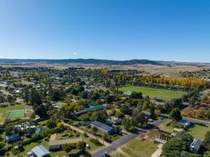 an aerial view of a small town with trees at Edelweiss Cottage in Berridale