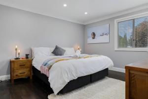 a bedroom with a large bed and a window at Edelweiss Cottage in Berridale