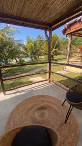 a patio with a table and a chair at Ankavia Lodge in Sainte Marie