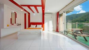 a bedroom with a bed and a large window at gapyeong newcastle pension in Gapyeong +2 photos