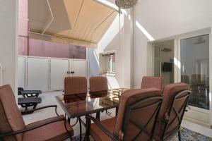 a dining room with a glass table and chairs at Dimora Collina 2 in Sannicola