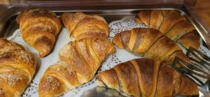 a tray filled with croissants on a table at Penzion Tavcar in Ljubljana