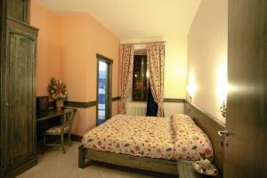 Postel nebo postele na pokoji v ubytování IL Postale