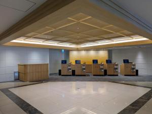 a large room with desks and cabinets in a building at Hotel Hokke Club Hiroshima in Hiroshima