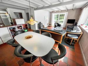 a living room with a white table and chairs at 0194-Romo-Rabjergvej-76 in Høm +7 photos
