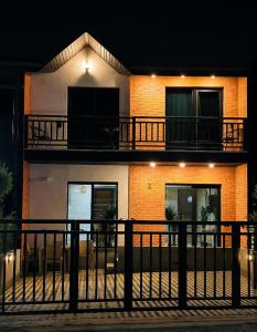 a building with a balcony on the side of it at Chanko's Cottages in Tsemi