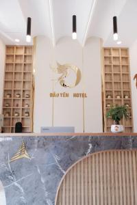 a dressing room with a counter and a sign at Đảo Yến Hotel 2 in Dong Hoi