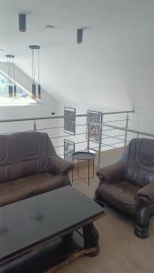 a living room with two couches and a coffee table at Tomberg 