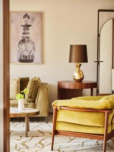 a living room with a couch and a table at Park Hyatt Zurich – City Center Luxury in Zurich