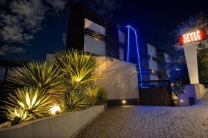 a building with a sign in front of it at night at Style Hotel ( Adults Only) in São Paulo
