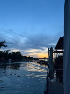 a view of a river at sunset from a boat at Vasilisa Luxury River House in Pančevo