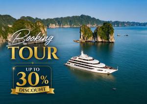 a cruise ship in the water with limestone islands at Madelise Ensora Hotel & Travel in Hanoi